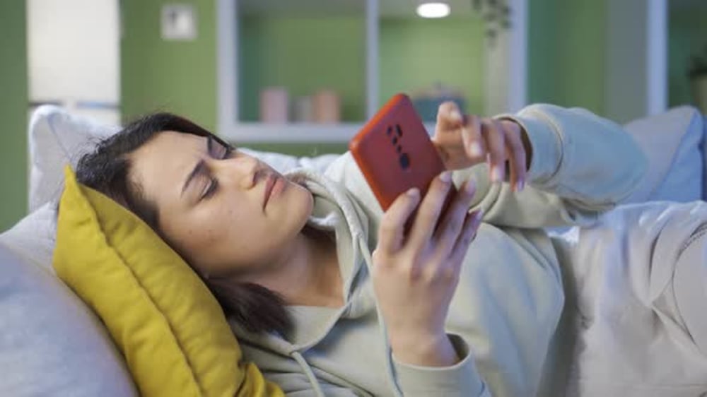 Woman Lies on Sofa Using Mobile Phone, People Stock Footage ft. woman ...