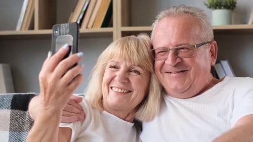 Loving Senior Couple Takes a Cheerful Selfie