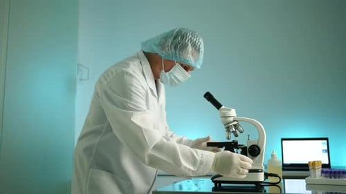 Scientist Examining Sample with Microscope in Bright Lab