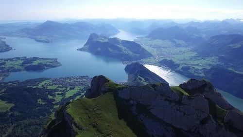 Aerial View of Serene Lake Surrounded By Mountains and Valleys Tranquil Landscape