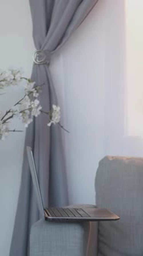 Young Man Playing Guitar and Singing Indoors