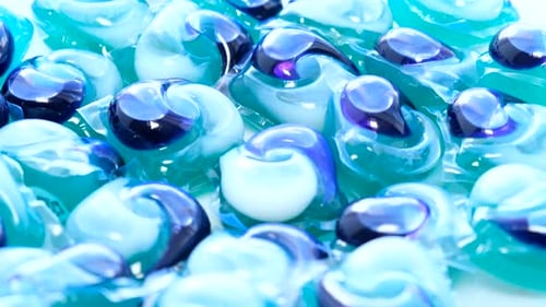 Powder and Liquid Blue Washing Machine Detergent Macro Rotation