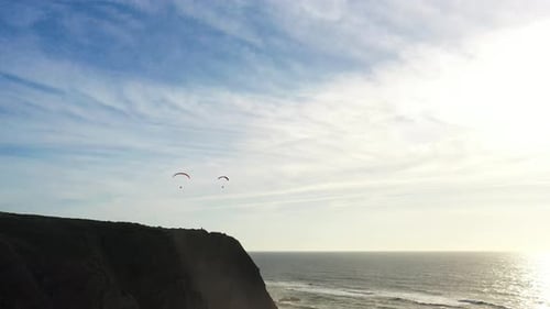 Extreme Paraglider Flying in Clear Blue Skies