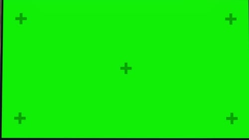 Desktop Computer with Mock-up Green Screen Standing on the Wooden Desk in the Modern Creative Offic