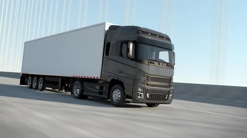 Semi-truck truck driving along a modern highway