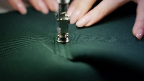 Sewing Machine Stitches Green Fabric Close Up