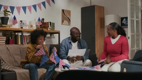 Family Making American Flag Decorations at Home