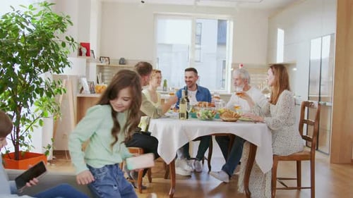 Family Celebrates Together at Home with a Toast