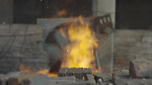 Ironworker Forging Hot Iron In A Fore, Metalwork Workshop