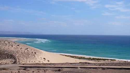 drone flying over suggestive coast of Fuerteventura: blue sea, beaches, tourism