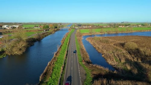 Aerial view of road and waterway near Ely, United Kingdom.