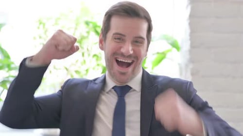 Cheerful Businessman Celebrates Success