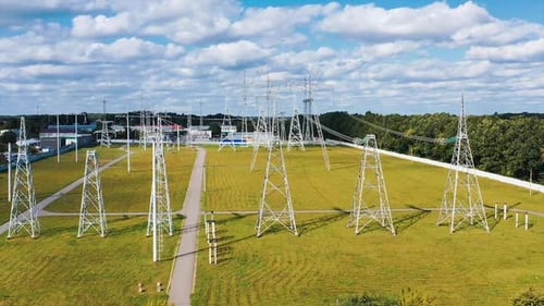 Long-range energy high voltage transmission. Electric transformers wires and grid.