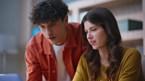 Young Adults Working Together at Computer