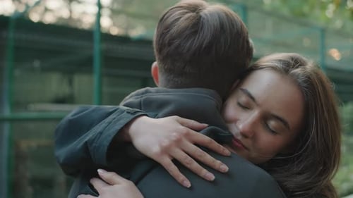 City Park Reunion with Warm Closeness Woman and Man Share Tender Outdoor Connection Emotional Moment