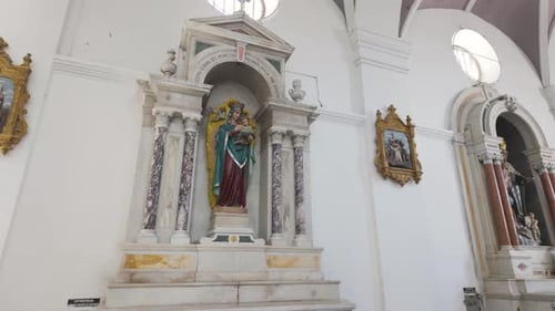 Slow panning shot of beautiful architecture within Santa Marta Cathedral
