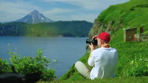 Summer Vacation In Nature Man Traveling In Mountains Photographing Beautiful Scenery From Top