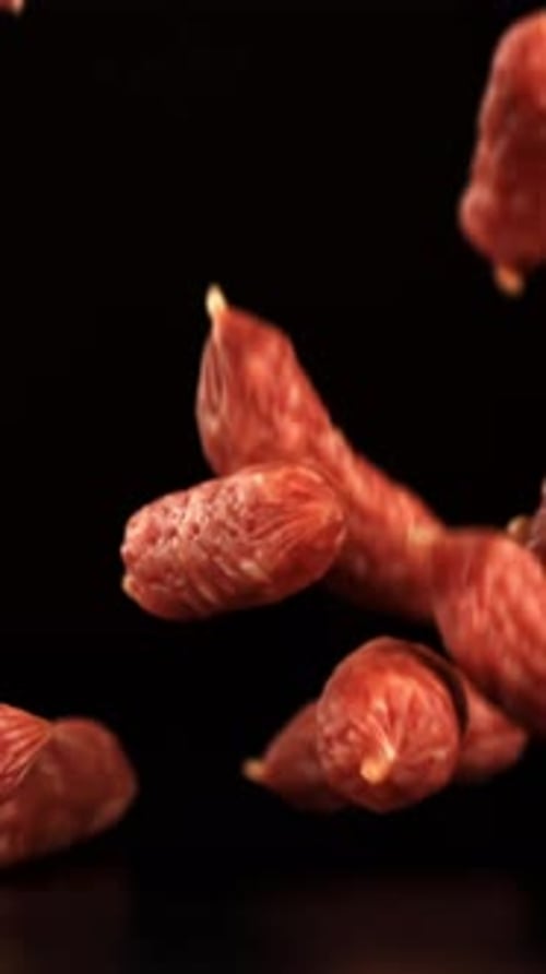 Mini Salami Fall on a Black Table Filmed on a Highspeed Camera at 1000 Fps