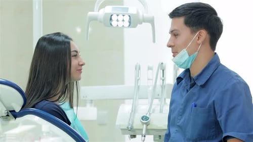 Female Patient Consulting with Dentist in Bright Office