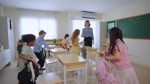Back to school of adorable student entering classroom at elementary school.