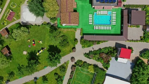 Green parks and playgrounds in recreation area. Modern resort area among nature in summer.