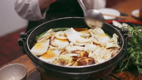 Cooking Herbal Mushroom Hotpot for a Delightful Culinary Experience