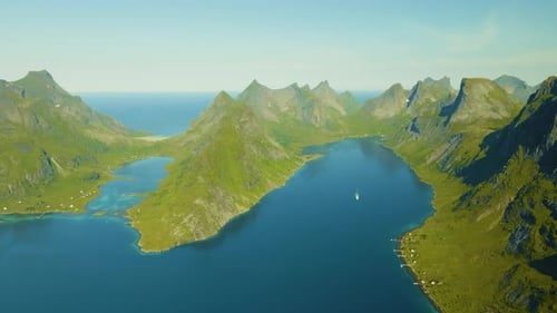 Drone footage of Lofoten’s jagged mountain peaks with a deep fjord winding between them. Sunlight