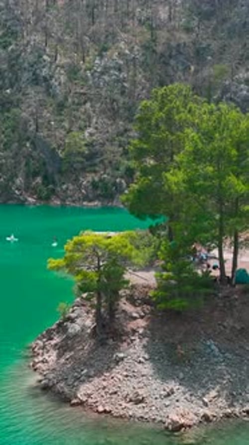 Vertical Video Scenic Canyon Paddleboarding Adventure With a Group of Close Friends