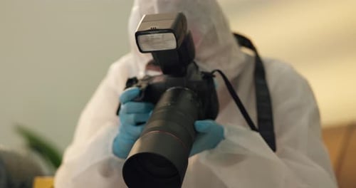 Forensic Scientist Photographing Investigation with Professional Camera