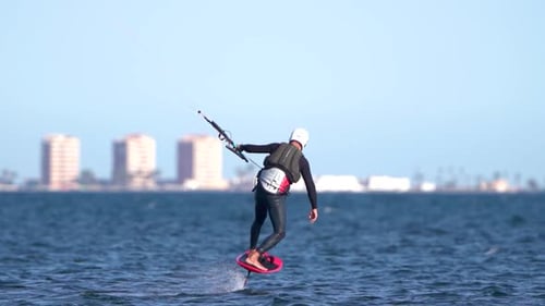 Sporstman practicce hydro foil kite surf boarding in Spain coast