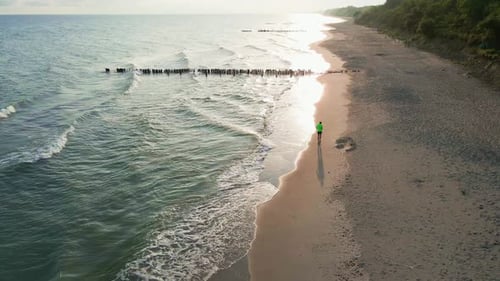 Man Running Along Sand Sea Beach at Morning Aerial View