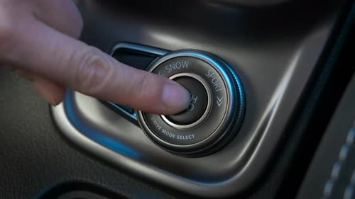 Finger Pushing Auto Drive Mode Button in Car