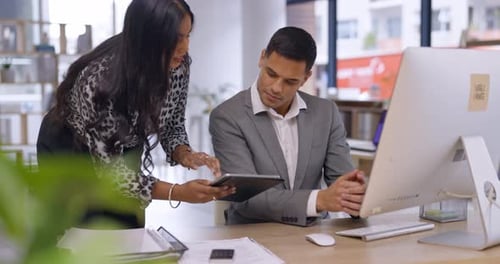 Business Colleagues Collaborating on Project in Urban Office