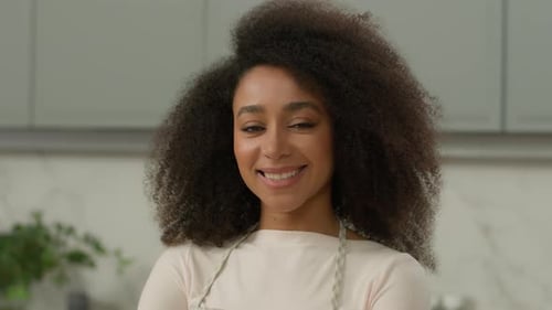 Smiling Woman Wearing Apron Indoors