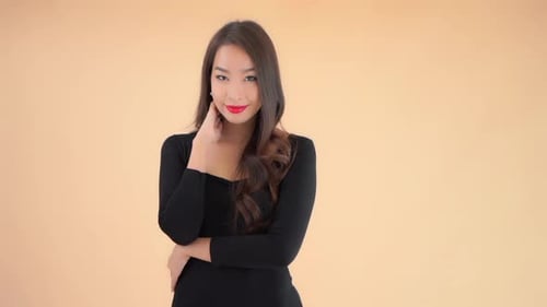 A beautiful woman poses and smiles in the left third of the frame.
