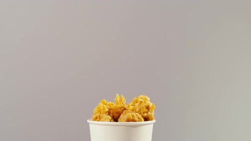 Delicious Golden Fried Chicken in a White Cup