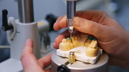 Manufacturing the model of denture. Close up.
