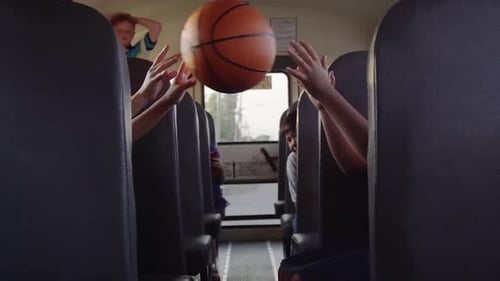 kids on the school bus - Basketball pass inside bus