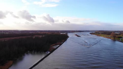 Boat Travels Through Beautiful Nature on River