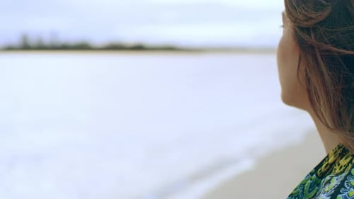 Young Woman Looking Out at the Water on a Beach in Australia