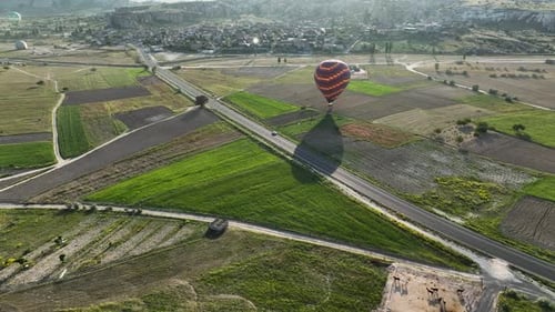Hot Air Balloons Fly Over the Mountainous Landscape of Cappadocia Turkey