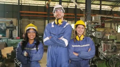 Professional industrial workers team in manufacturing factory.