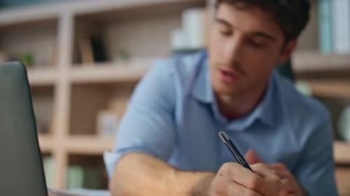 Closeup Hands Making Notes in Office Sales Professional Talking Video Meeting
