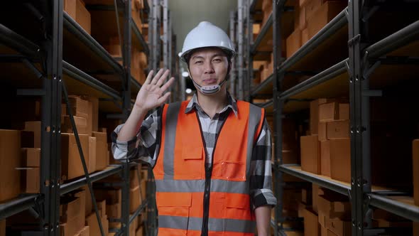 Asian Male Engineer Smiling And Waving Hand Saying Good Bye In The ...