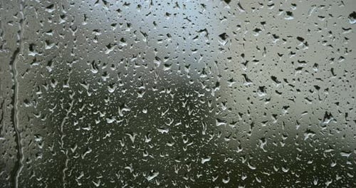 Rain Drops on Window Glass Background