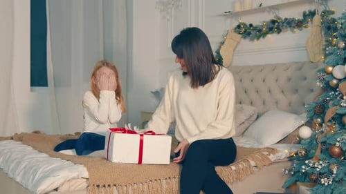 Festive Christmas: Mother and Daughter Celebrate Gift