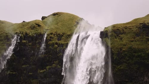 Majestic Waterfall Cascading Down Rocky Cliff