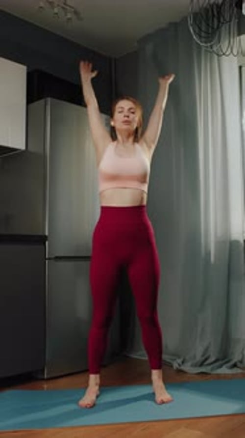 Woman Stretching Arm Muscles Before Her Home Workout