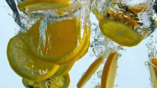Sliced Sweet Orange Fall Clear Water in Super Close Up