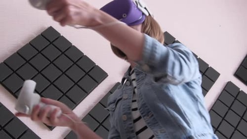 Woman Plays Game with Virtual Reality Headset